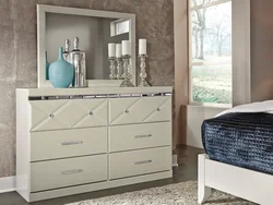Chest of drawers on the wall in the bedroom photo