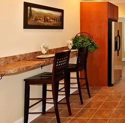Photo of a small kitchen table against the wall