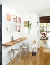 Photo of a small kitchen table against the wall