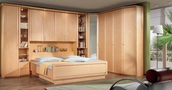 Bedroom wall with bed photo