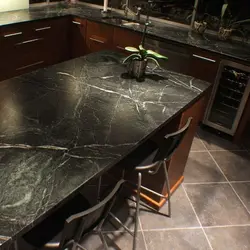 Kitchen with black marble countertop photo