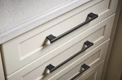 White kitchen handles photo