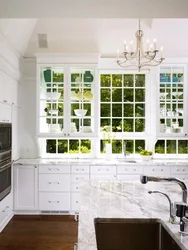 Window design in a white kitchen photo