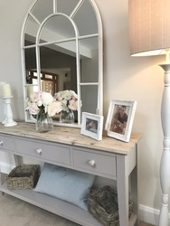 Mirror with table in the hallway photo
