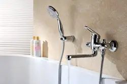 Bathtub and faucets with long photo