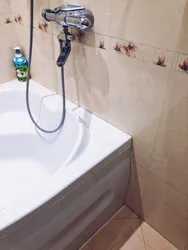 Faucet with tiles in the bathroom photo