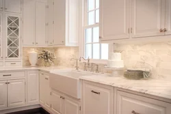 Light tiles in the kitchen interior photo