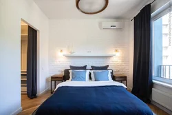Photo of a bedroom with flowers at the headboard