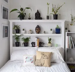 Photo of a bedroom with flowers at the headboard