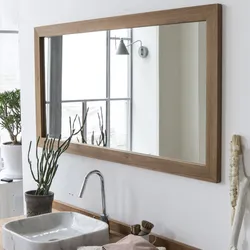 Wooden bathroom mirror photo