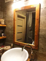 Wooden bathroom mirror photo