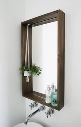 Wooden bathroom mirror photo