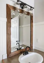 Wooden bathroom mirror photo