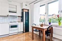 Refrigerator in the interior of a bright kitchen photo