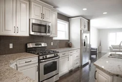Refrigerator in the interior of a bright kitchen photo