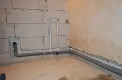 Pipes In The Floor In The Bathroom Photo
