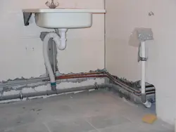 Pipes In The Floor In The Bathroom Photo