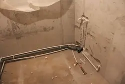 Pipes In The Floor In The Bathroom Photo