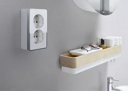 Socket and switch in the bathroom photo