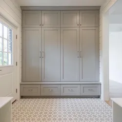 White hinged wardrobes in the hallway photo