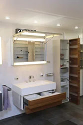 Tall cabinet in the bathroom photo