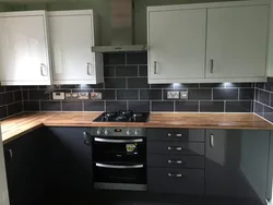 Gray Kitchen With Brown Apron Photo