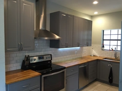 Gray kitchen with brown apron photo
