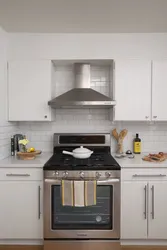 Kitchens with a cabinet above the stove photo