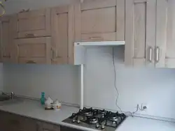 Kitchens with a cabinet above the stove photo