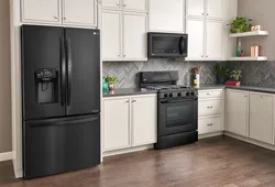 Gray kitchen with black refrigerator photo