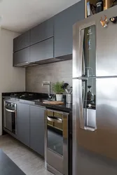 Gray kitchen with black refrigerator photo