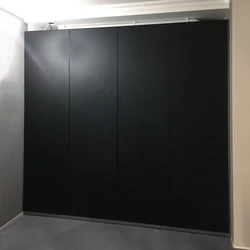 Black wardrobe in the hallway photo