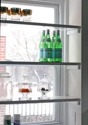 Shelf on the windowsill in the kitchen photo