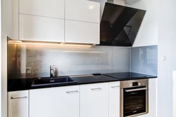 White kitchen with built-in hood photo