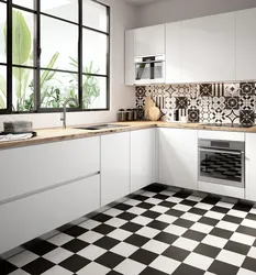 White Kitchen On Black Tiles Photo