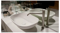 Faucet on the countertop in the bathroom photo