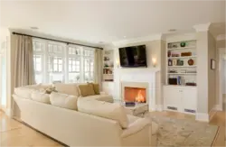 Light fireplace in the living room interior photo