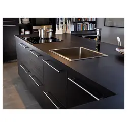 Black handles on kitchen facades photo
