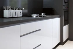 Black handles on kitchen facades photo
