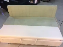 Narrow sofa with sleeping place photo