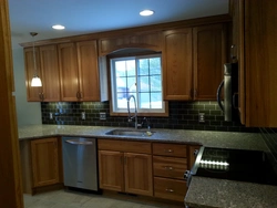 Photo Of A Kitchen With A Set In The Middle