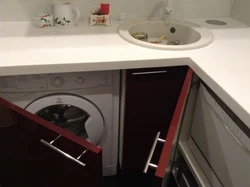 Washing machine with sink in the kitchen photo