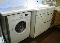Washing machine with sink in the kitchen photo