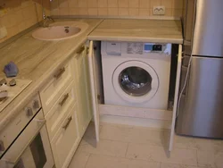 Washing machine with sink in the kitchen photo