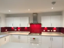 Gray kitchen with red apron photo