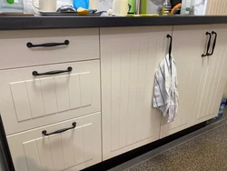 Kitchen with black handles and brackets photo
