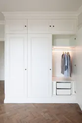 Built-in wardrobe in the hallway white photo