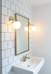 Bath sconce on the mirror photo