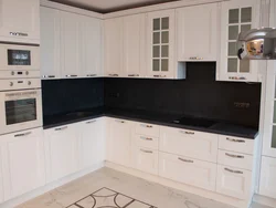 Light kitchen with black apron photo