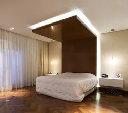 Plasterboard above the bed in the bedroom photo